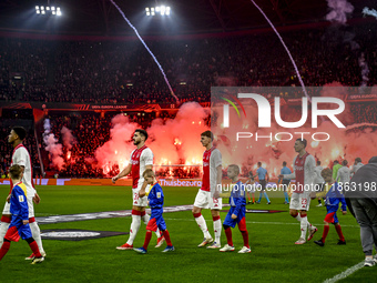 AFC Ajax Amsterdam defender Josip Sutalo, AFC Ajax Amsterdam defender Youri Baas, and AFC Ajax Amsterdam forward Steven Berghuis participate...