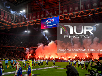 Fans of Ajax use fireworks during the match between Ajax and Lazio at the Johan Cruijff ArenA for the UEFA Europa League - League phase - Ma...