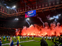 Fans of Ajax use fireworks during the match between Ajax and Lazio at the Johan Cruijff ArenA for the UEFA Europa League - League phase - Ma...