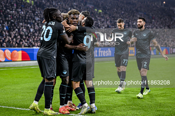 Lazio midfielders Loum Tchaouna and Fisayo Dele-Bashiru, along with Lazio forward Pedro Rodriguez, celebrate a goal during the match between...