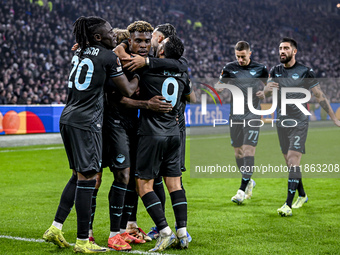 Lazio midfielders Loum Tchaouna and Fisayo Dele-Bashiru, along with Lazio forward Pedro Rodriguez, celebrate a goal during the match between...