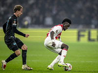 Lazio midfielder Nicolo Rovella and AFC Ajax Amsterdam forward Bertrand Traore play during the match between Ajax and Lazio at the Johan Cru...