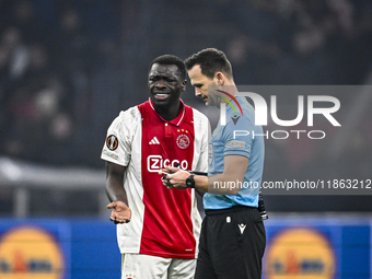 AFC Ajax Amsterdam forward Brian Brobbey and referee Ivan Kruzliak participate in the match between Ajax and Lazio at the Johan Cruijff Aren...