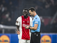 AFC Ajax Amsterdam forward Brian Brobbey and referee Ivan Kruzliak participate in the match between Ajax and Lazio at the Johan Cruijff Aren...