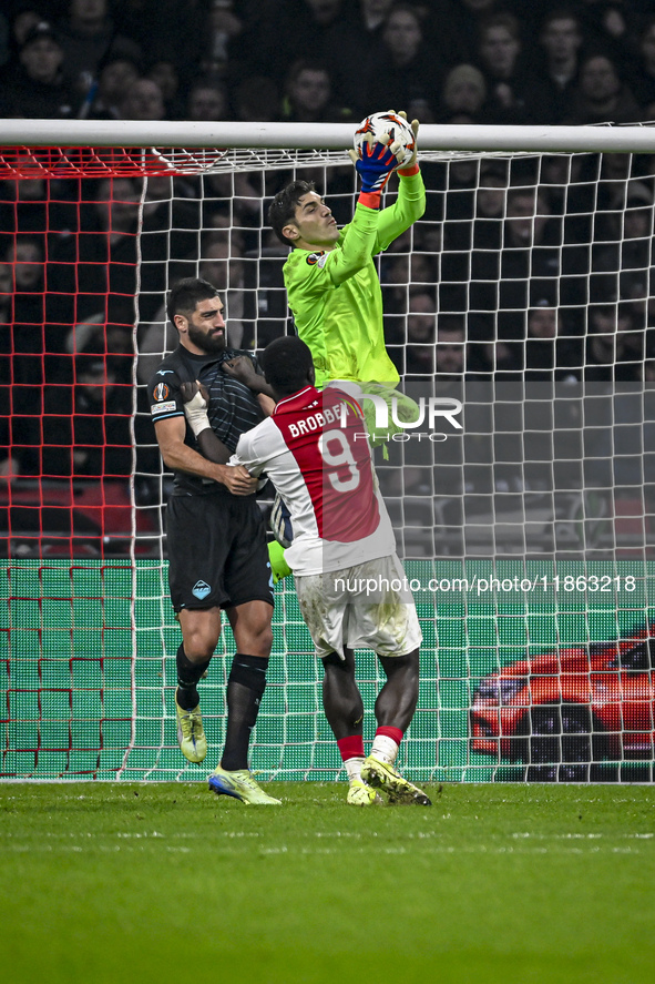 Lazio defender Samuel Gigot and Lazio goalkeeper Christos Mandas participate in the match between Ajax and Lazio at the Johan Cruijff ArenA...