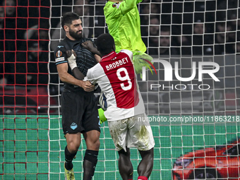 Lazio defender Samuel Gigot and Lazio goalkeeper Christos Mandas participate in the match between Ajax and Lazio at the Johan Cruijff ArenA...