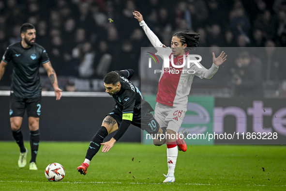 Lazio forward Mattia Zaccagni and AFC Ajax Amsterdam midfielder Kian Fitz-Jim play during the match between Ajax and Lazio at the Johan Crui...