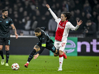 Lazio forward Mattia Zaccagni and AFC Ajax Amsterdam midfielder Kian Fitz-Jim play during the match between Ajax and Lazio at the Johan Crui...