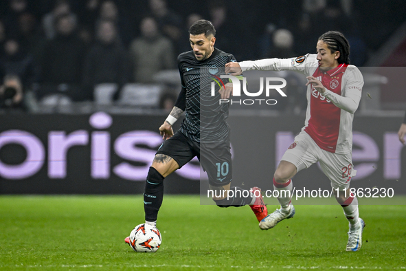 Lazio forward Mattia Zaccagni and AFC Ajax Amsterdam midfielder Kian Fitz-Jim play during the match between Ajax and Lazio at the Johan Crui...