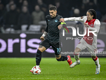 Lazio forward Mattia Zaccagni and AFC Ajax Amsterdam midfielder Kian Fitz-Jim play during the match between Ajax and Lazio at the Johan Crui...