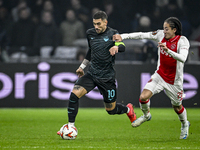 Lazio forward Mattia Zaccagni and AFC Ajax Amsterdam midfielder Kian Fitz-Jim play during the match between Ajax and Lazio at the Johan Crui...