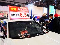 Exhibitors present subsidies and preferential promotion measures at the 16th Shandong International Auto Show 2024 in Qingdao, China, on Dec...