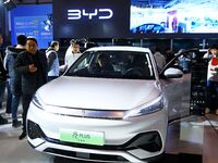 People view cars at the 16th Shandong International Auto Show in Qingdao, China, on December 13, 2024. (