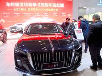 People view cars at the 16th Shandong International Auto Show in Qingdao, China, on December 13, 2024. (