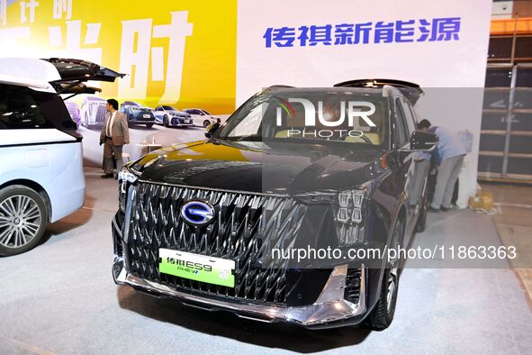 People view cars at the 16th Shandong International Auto Show in Qingdao, China, on December 13, 2024. 