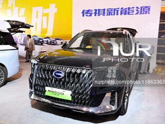 People view cars at the 16th Shandong International Auto Show in Qingdao, China, on December 13, 2024. (