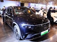 People view cars at the 16th Shandong International Auto Show in Qingdao, China, on December 13, 2024. (