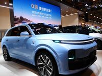 People view cars at the 16th Shandong International Auto Show in Qingdao, China, on December 13, 2024. (