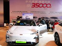 People view cars at the 16th Shandong International Auto Show in Qingdao, China, on December 13, 2024. (