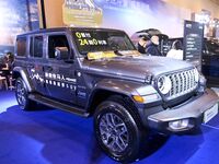 People view cars at the 16th Shandong International Auto Show in Qingdao, China, on December 13, 2024. (