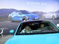 People view cars at the 16th Shandong International Auto Show in Qingdao, China, on December 13, 2024. (