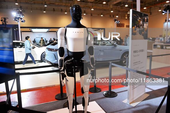 A Tesla humanoid robot is displayed at the 16th Shandong International Auto Show 2024 in Qingdao, China, on December 13, 2024. 