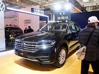 People view cars at the 16th Shandong International Auto Show in Qingdao, China, on December 13, 2024. (