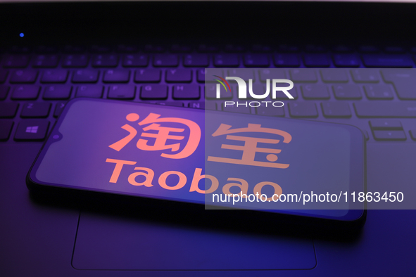 The Taobao logo appears on the screen of a smartphone in Reno, United States, on December 12, 2024 