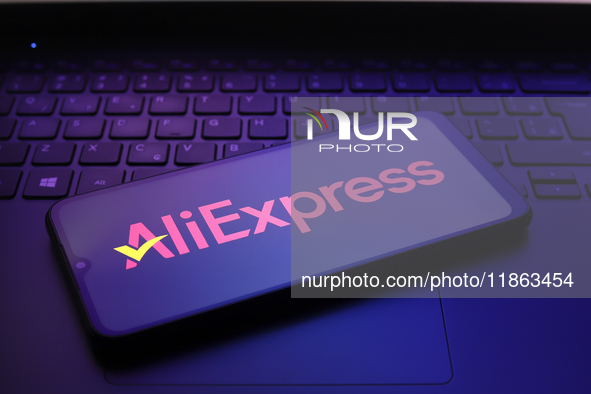 The AliExpress logo appears on the screen of a smartphone in Reno, United States, on December 12, 2024. 