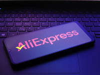 The AliExpress logo appears on the screen of a smartphone in Reno, United States, on December 12, 2024. (