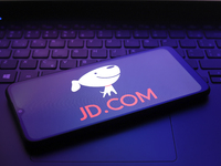 The JD.com (Jingdong) logo appears on the screen of a smartphone in Reno, United States, on December 12, 2024 (