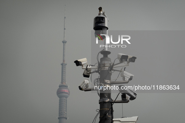 Security cameras are on a pole near the Bund Square in Shanghai, China, on December 13, 2024. 