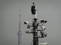 Security cameras are on a pole near the Bund Square in Shanghai, China, on December 13, 2024. (