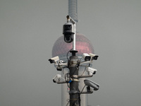 Security cameras are on a pole near the Bund Square in Shanghai, China, on December 13, 2024. (