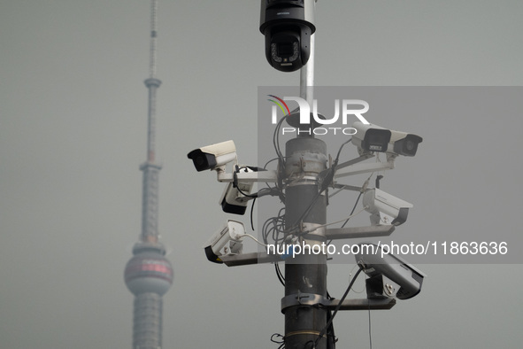 Security cameras are on a pole near the Bund Square in Shanghai, China, on December 13, 2024. 