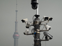 Security cameras are on a pole near the Bund Square in Shanghai, China, on December 13, 2024. (