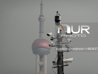 Security cameras are on a pole near the Bund Square in Shanghai, China, on December 13, 2024. (