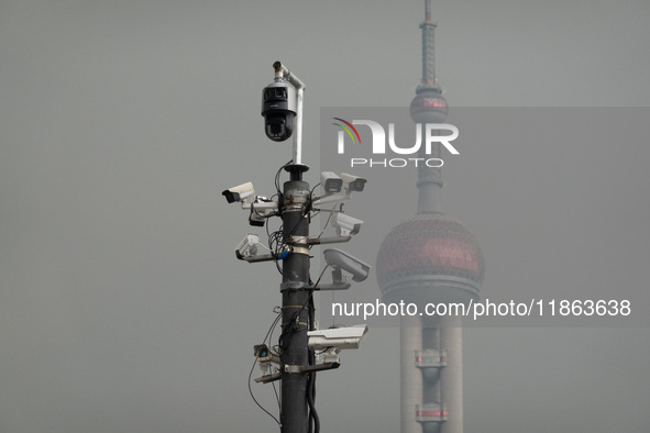 Security cameras are on a pole near the Bund Square in Shanghai, China, on December 13, 2024. 