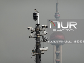 Security cameras are on a pole near the Bund Square in Shanghai, China, on December 13, 2024. (