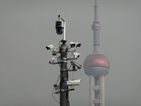 Security cameras are on a pole near the Bund Square in Shanghai, China, on December 13, 2024. (