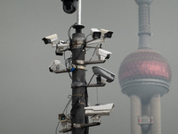 Security cameras are on a pole near the Bund Square in Shanghai, China, on December 13, 2024. (