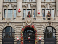 Santa Claus decorations are seen on the exterior wall of Roosevelt Residence on the Bund in Shanghai, China, on December 13, 2024. (