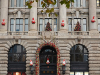 Santa Claus decorations are seen on the exterior wall of Roosevelt Residence on the Bund in Shanghai, China, on December 13, 2024. (