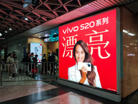 An LED screen displays tennis star Zheng Qinwen's vivo mobile phone advertisement in a subway transfer channel in Shanghai, China, on Decemb...