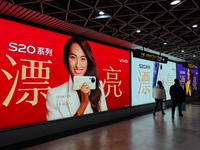 An LED screen displays tennis star Zheng Qinwen's vivo mobile phone advertisement in a subway transfer channel in Shanghai, China, on Decemb...