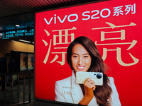 An LED screen displays tennis star Zheng Qinwen's vivo mobile phone advertisement in a subway transfer channel in Shanghai, China, on Decemb...