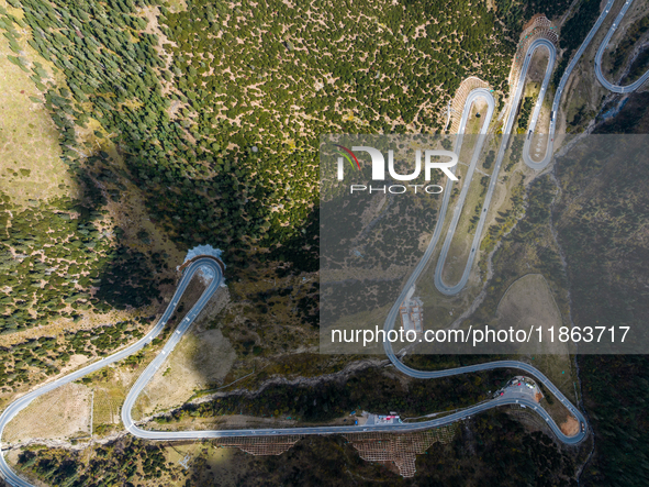 The winding road of National Highway 318 is in Ganzi Prefecture, Sichuan province, China, on October 18, 2024. 