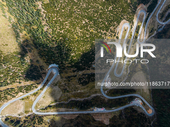 The winding road of National Highway 318 is in Ganzi Prefecture, Sichuan province, China, on October 18, 2024. (