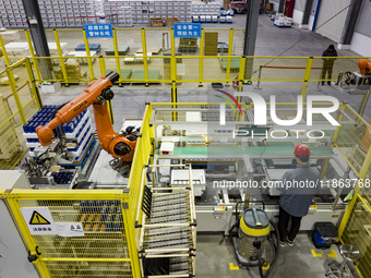 Workers build a new energy vehicle ro-ro ship at the Huaxing Ship Construction base in Zigui County, Yichang City, Hubei province, China, on...