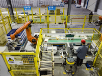 Workers build a new energy vehicle ro-ro ship at the Huaxing Ship Construction base in Zigui County, Yichang City, Hubei province, China, on...